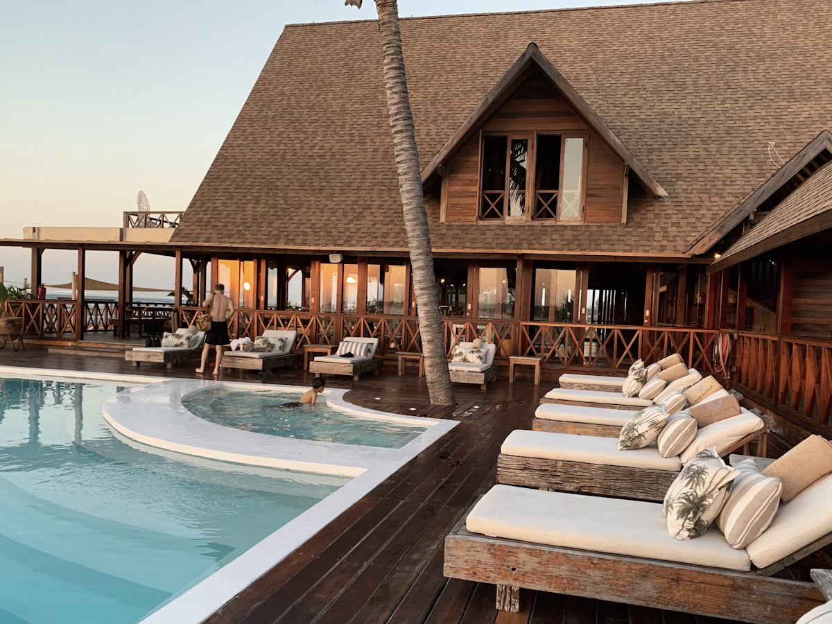 The Country Club Of Colorado grand clubhouse surrounded by mature trees and manicured grounds